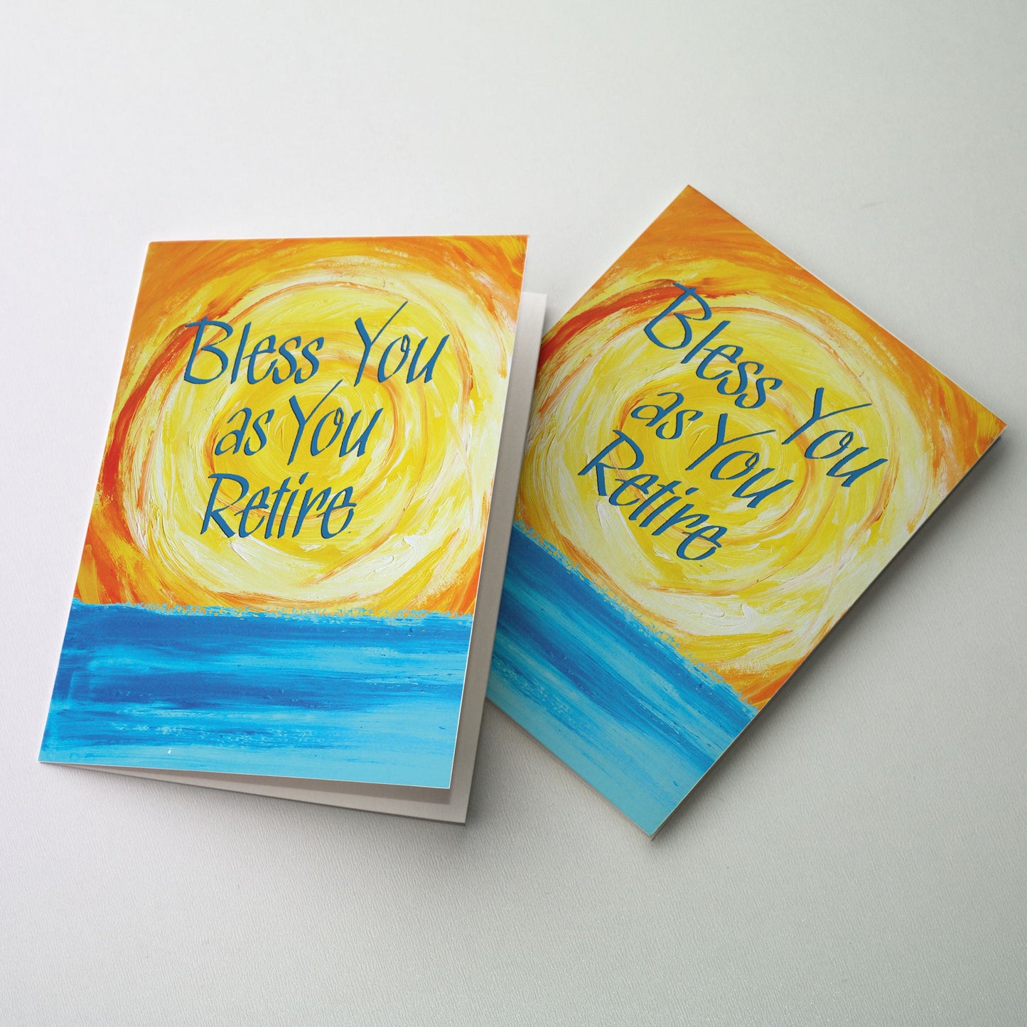 Blue lettering over brilliant red, orange and yellow sunset over bright blue water.