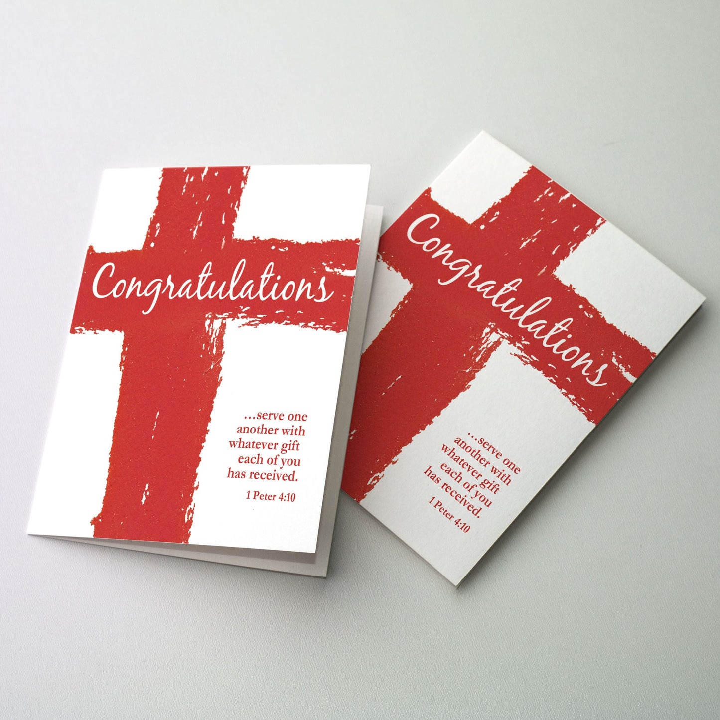 Red cross made of paint strokes and white script lettering on the transept with smaller red bible verse in the lower right-hand corner