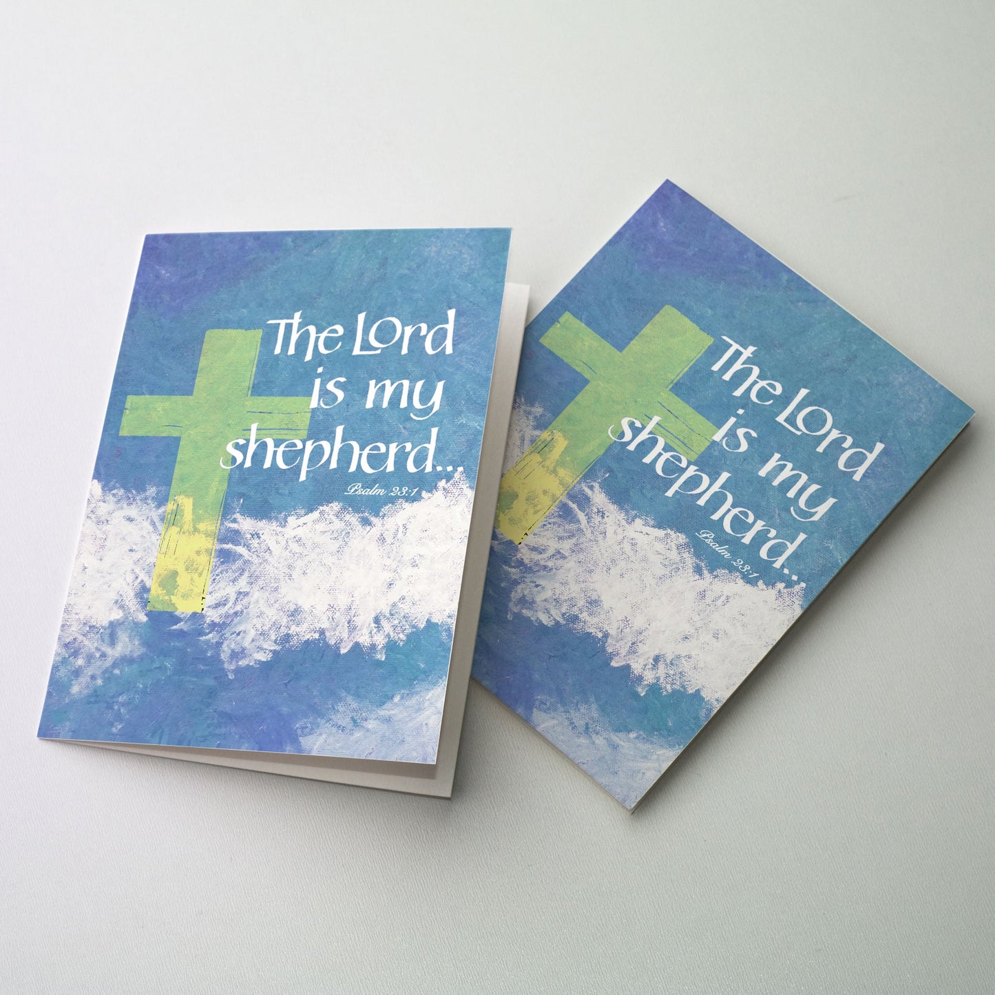 White calligraphy on blue and white background with a green cross.