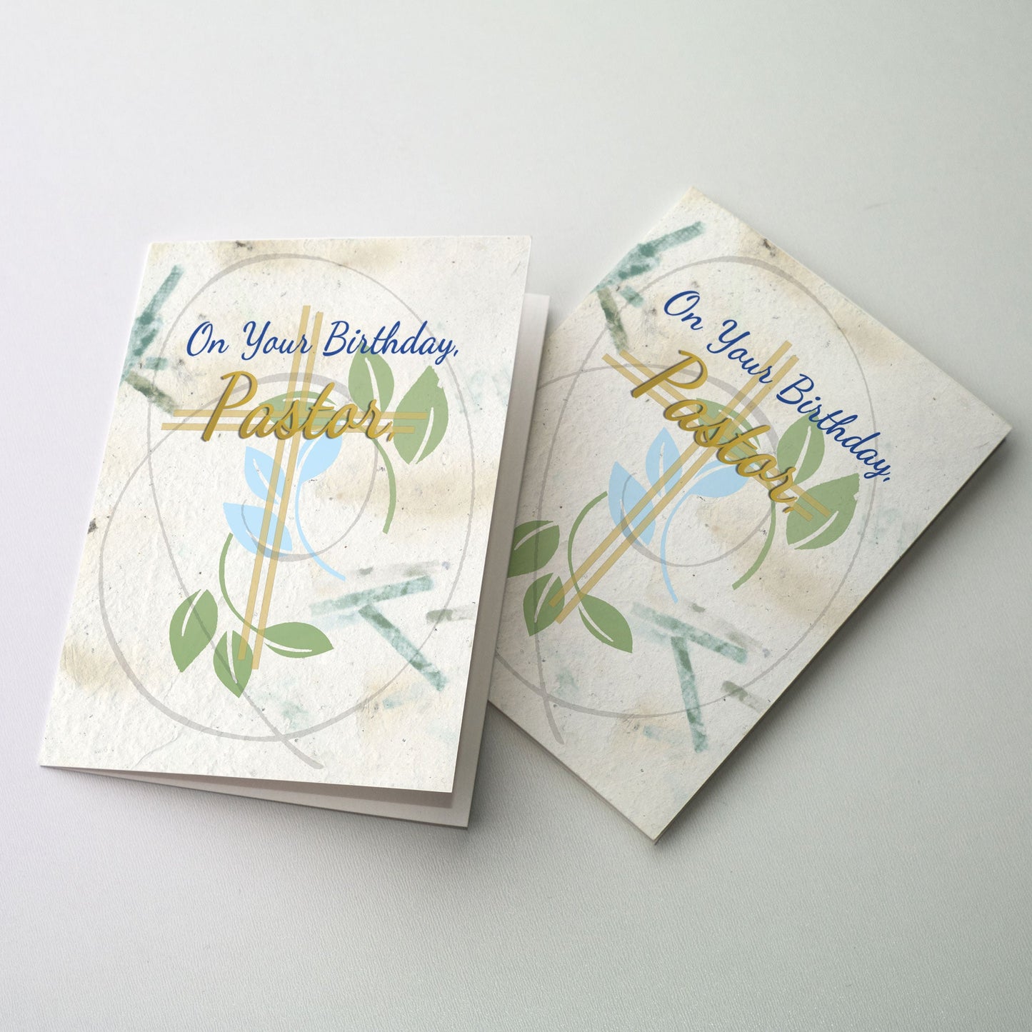 Green leaves on a handmade paper background surround the cover text.