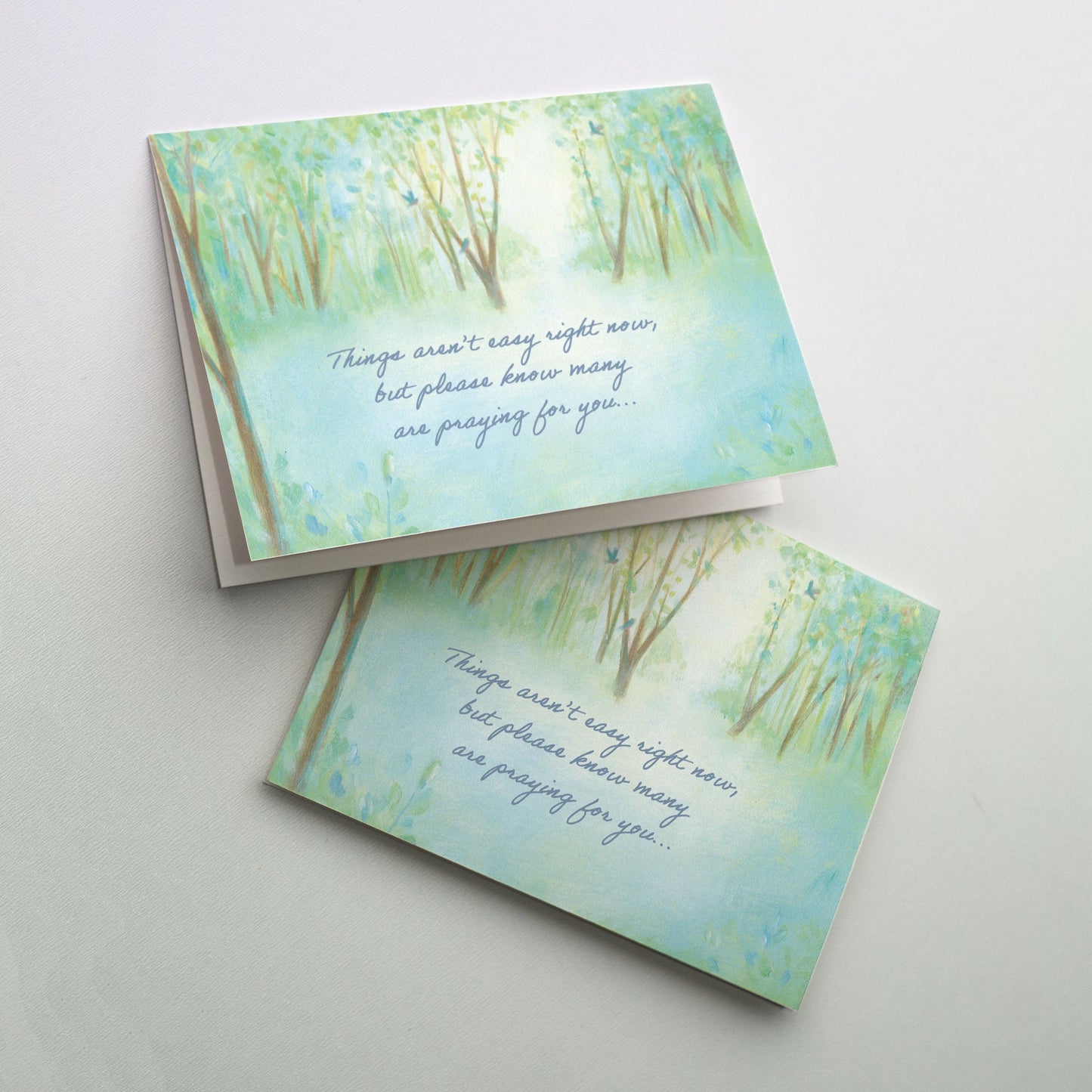 Softly painted forest setting with three bluebirds