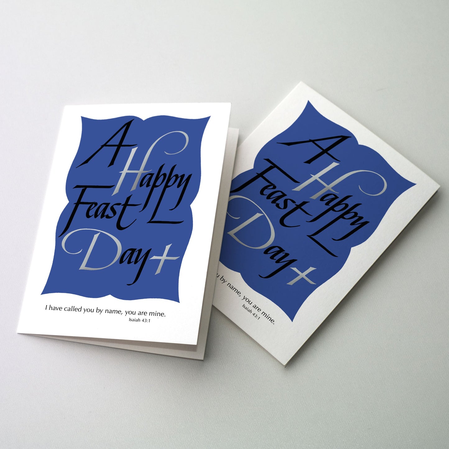 Calligraphy with sollver metallic ink accents on a rich blue background