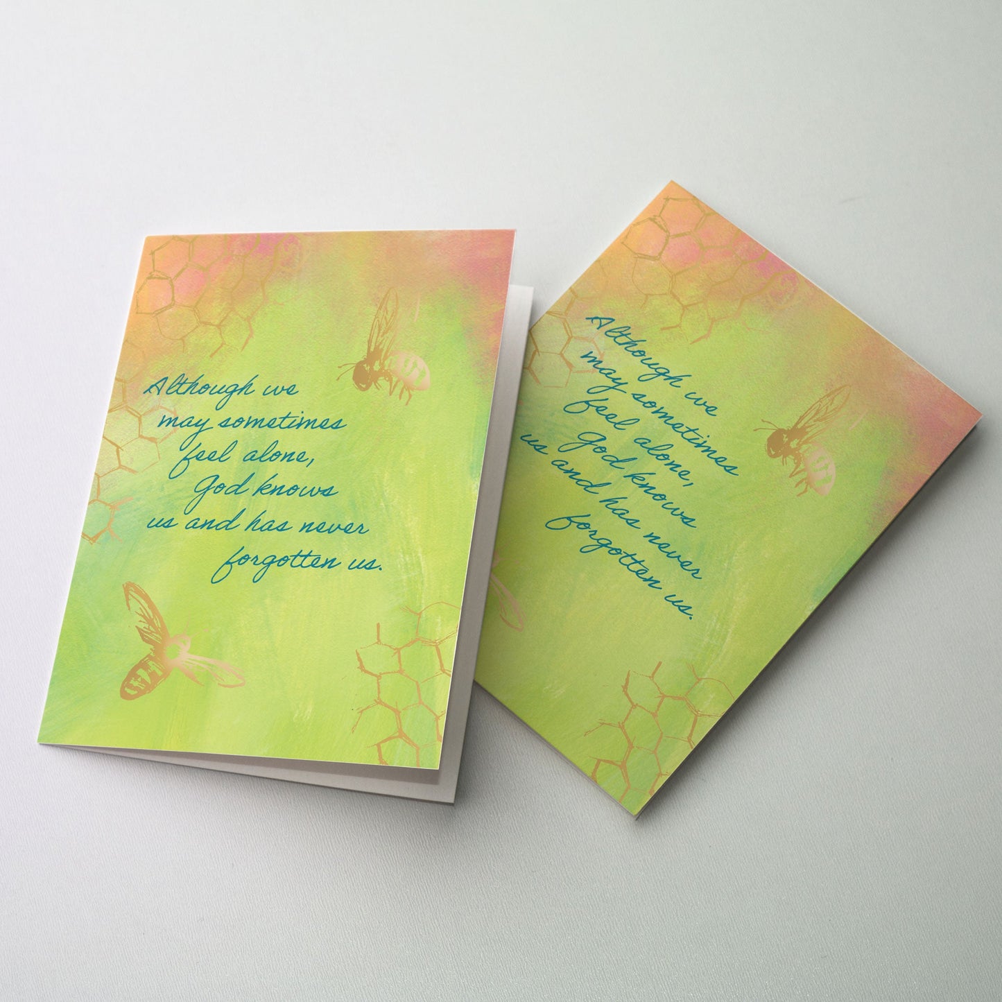 Soft gold images of honey bees on pastel background