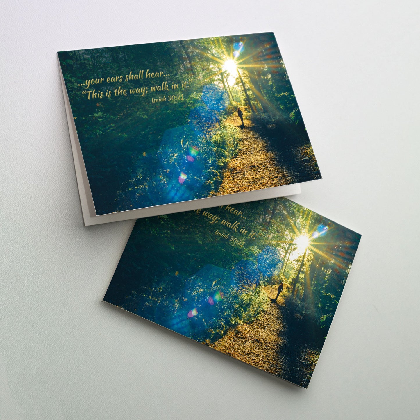 Send this biblically inspired Graduation card to your beloved graduate. The cover photograph shows a person walking on a trail with a bright sun lighting the way.