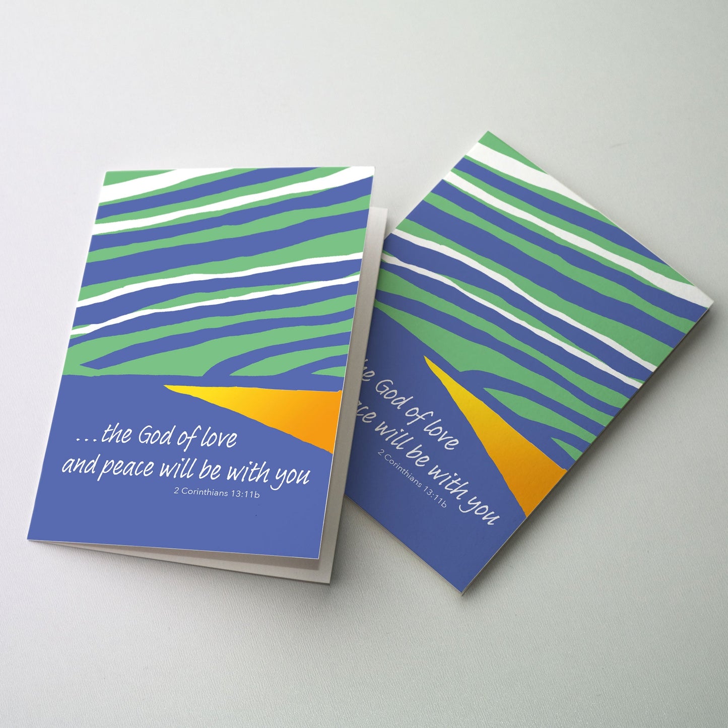 Bright colorful, graphic stripes in blues and greens with an accent of yellow