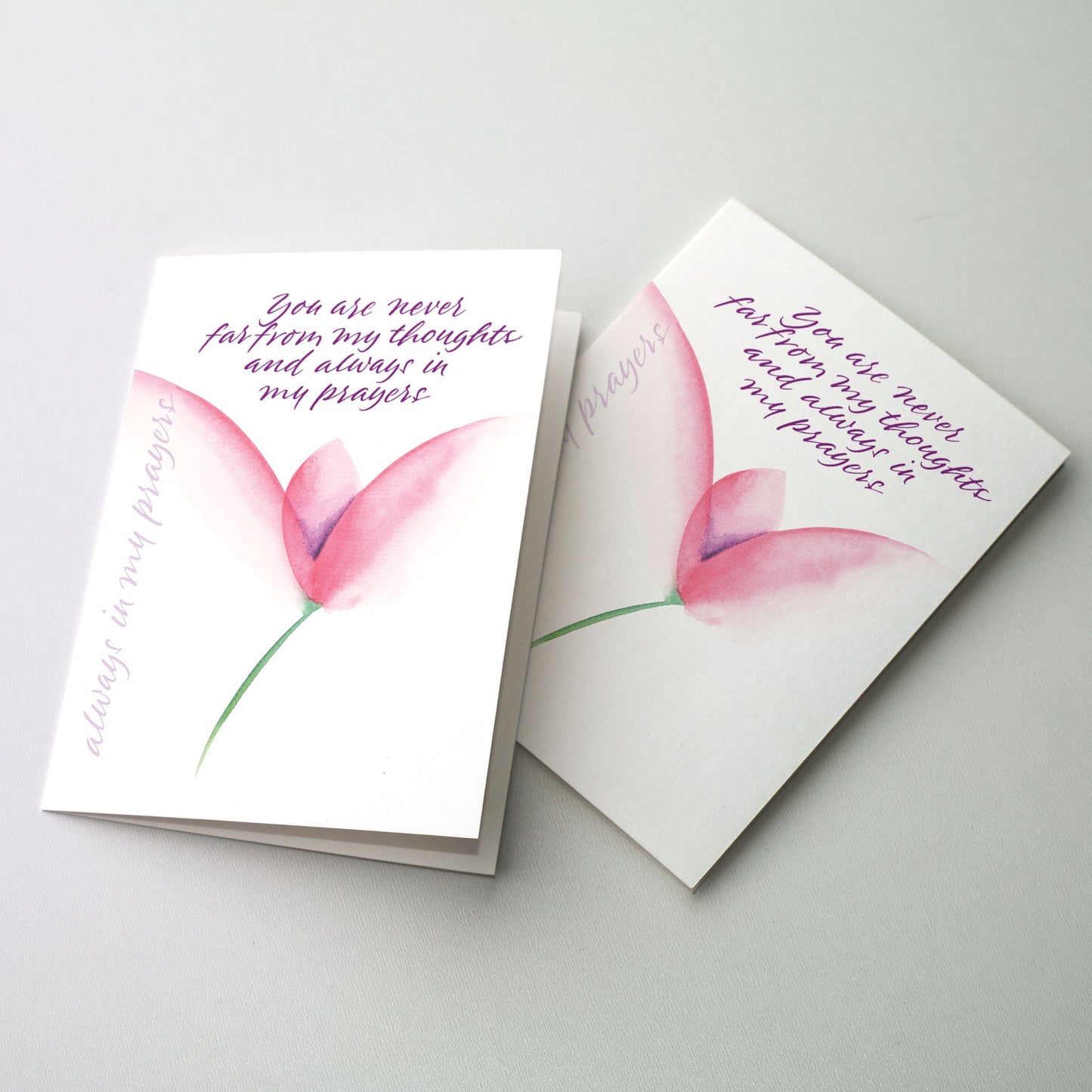 Express your thoughts of concern and prayer in calligraphy accented by a dark pink flower. The cards measure 5" x 7". Printed on recycled paper.