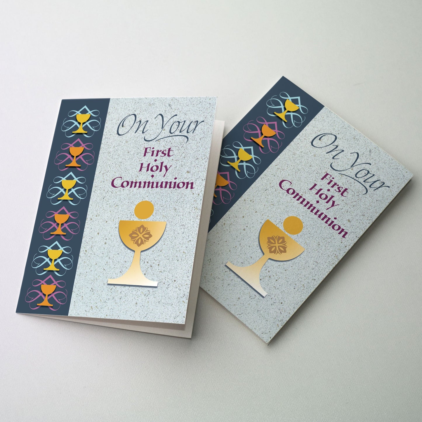 Chalice and host on blue speckled panel at right with dark blue panel at left with chalices. Rejoice with those receiving their First Communion. 5" x 7" card with matching envelope.