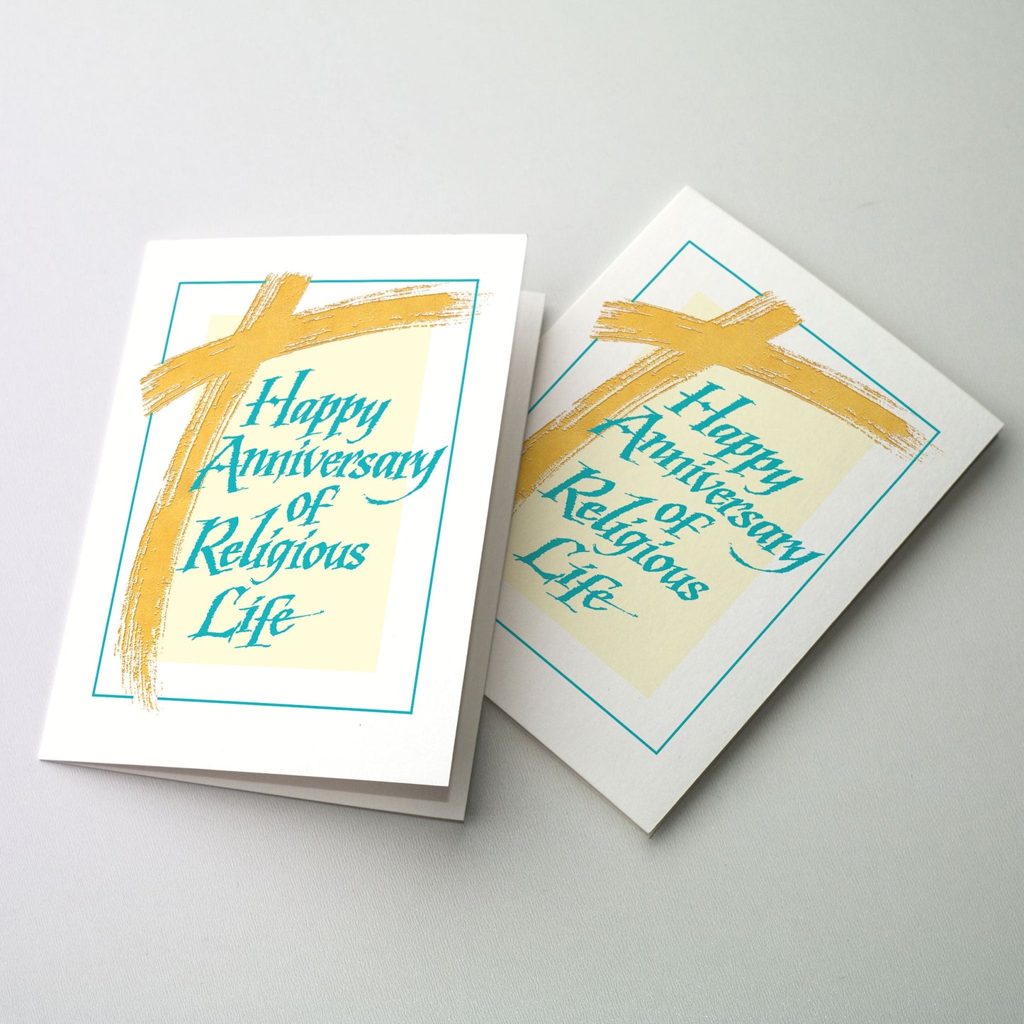 <p>Contemporary brush stroke cross in gold with rough-edges Italic lettering in a teal color. A thin teal colored line frames the image.</p>