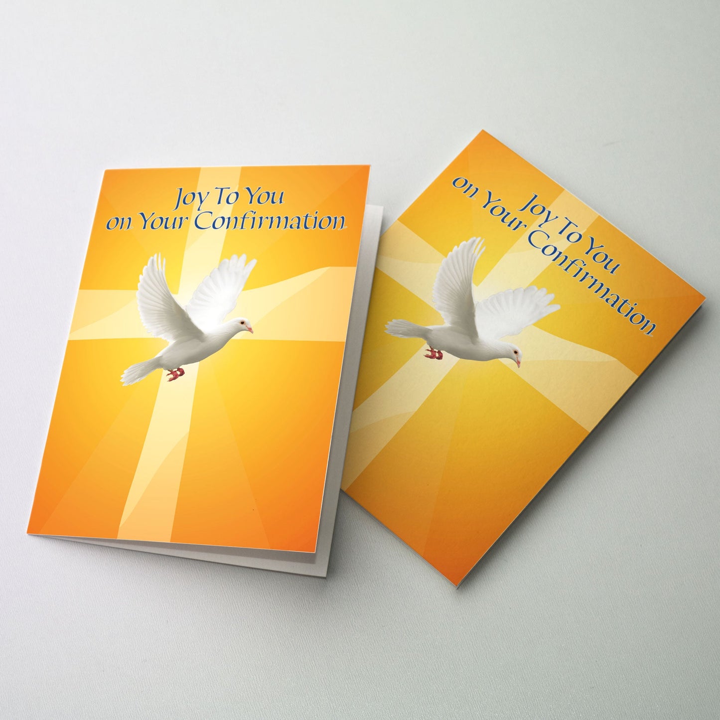 A photo of a descending white dove. A cross is in the background on a ground of shades of orange.