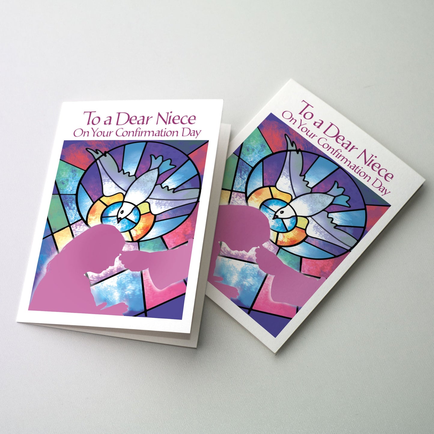 <p>A silhouette of the hand of the bishop anointing the forehead of a young woman. A colorful stained glass window of the Holy Spirit is in the background.</p>