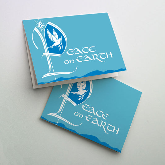 A white dove with olive branch inside a large start letter "P" for the word "Peace" of "Peace on Earth". The background in a light teal color with dark blue mountains and hills visible at the bottom of the card. A bright star is above the initial letter.