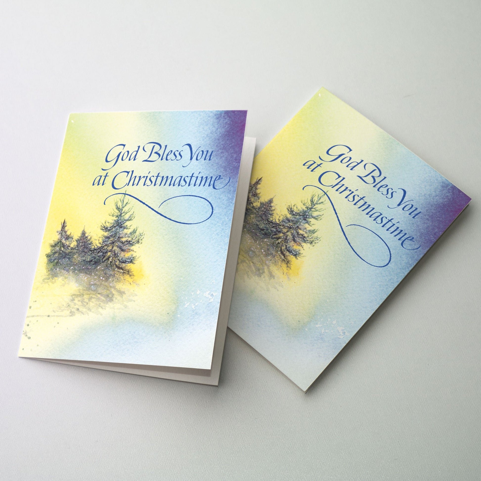 Warm golden light shining down on small water color trees.