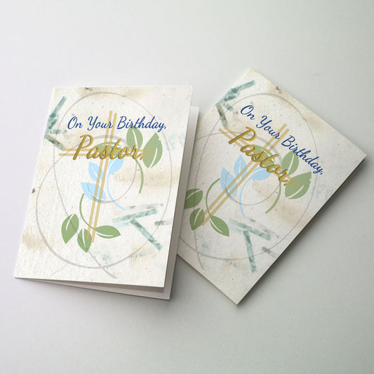 Green leaves on a handmade paper background surround the cover text.