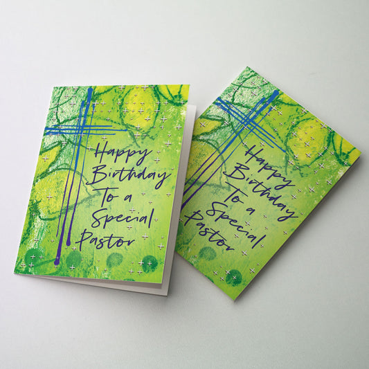 Blue contemporary cross on green leafy background