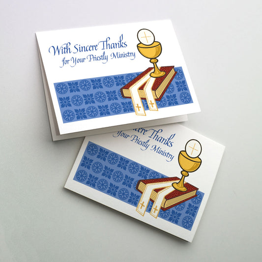 7&quot; x 5&quot;. Cup with host, stole and Gospel book on a blue patterned background.